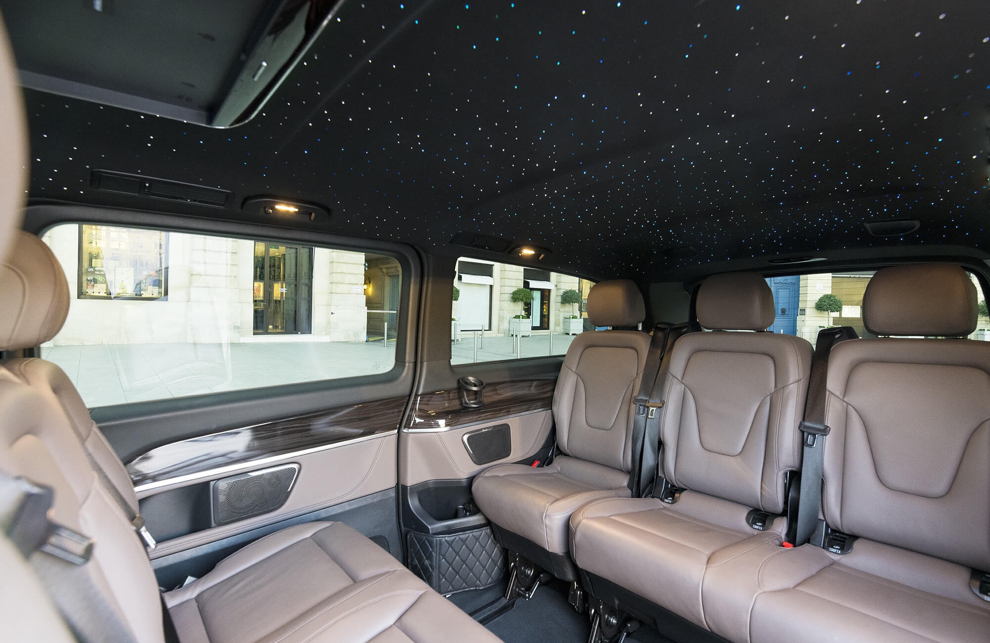 A luxury van under a starry sky